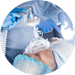 Ventilator-assisted patient care in a hospital setting.