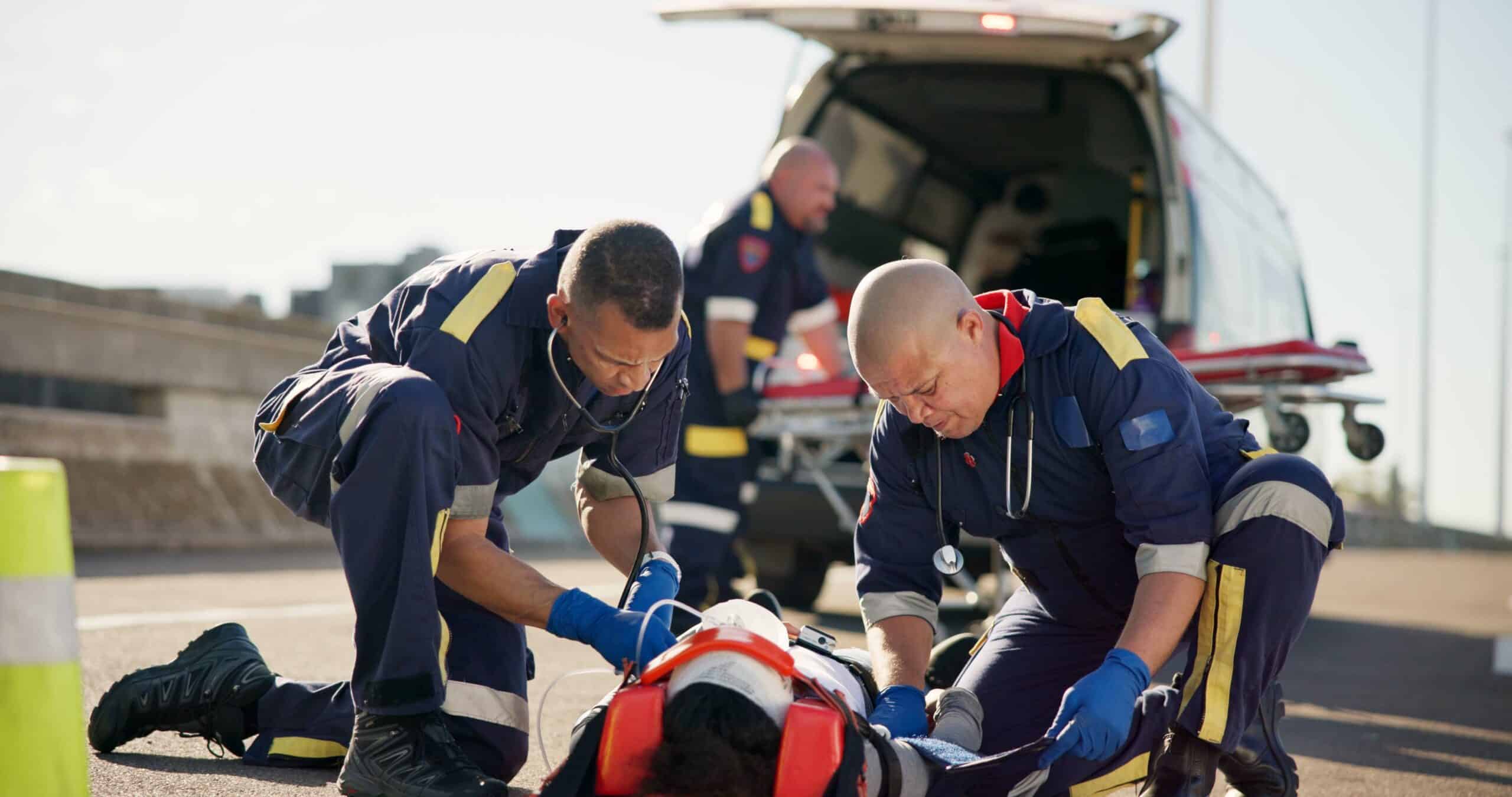 Emergency responders providing medical care at the scene.