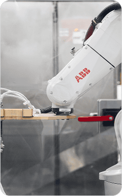 ABB robotic arm performing precise manufacturing tasks in a clean industrial environment.