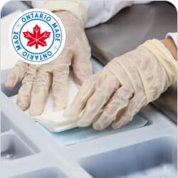 Disposable medical gloves being worn during a procedure.